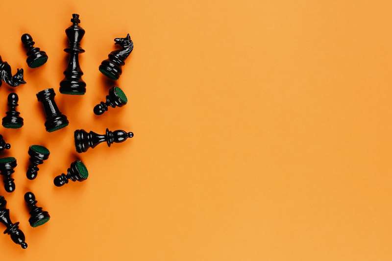 Photo by Karolina Grabowska: https://www.pexels.com/photo/black-chess-pieces-on-yellow-background-5477776/